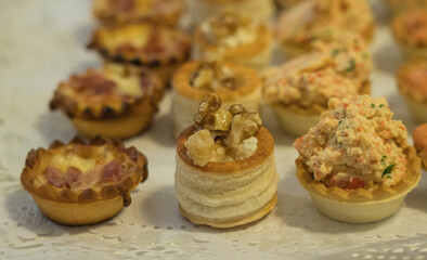 Assorted christmas canapes on festive holiday table