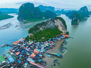 Aerial view Colorful house roofs on a village on Koh Panyee.
amazing village on sea water.
The...