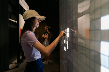 Woman using interactive digital screen
