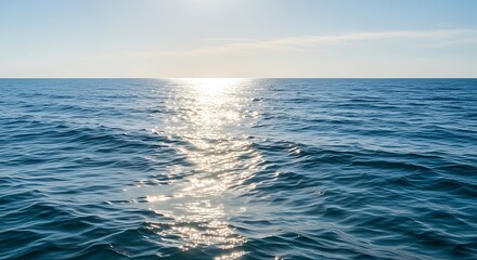 Wide ocean view, sun glinting on water