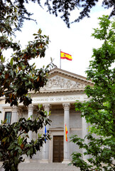 Exterior of the Congress of Deputies in Madrid, the capital of Spain, At the roof the Spanish national flag