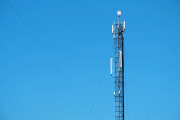 Maintenance staff at the work. High-altitude work. Worker repair cell tower