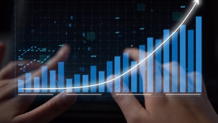 Close-up of hands interacting with a digital tablet showcasing diverse stock market data and growth graphs, reflecting modern business analysis and investment strategies. Copula
