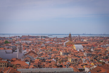 Fototapeta premium Panoramic view over Venetian rooftops and lagoon