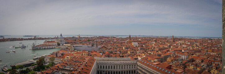 Fototapeta premium Wide panoramic view of Venice with lagoon and rooftops