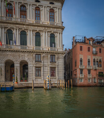 Naklejka premium Venetian palaces and gondolas along the Grand Canal at sunset