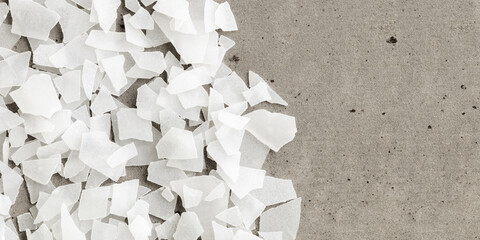 Close-Up of Magnesium Salt Flakes on grey banner background, detailed white particles sea salt,...