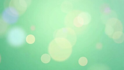 Soft, luminous bokeh lights create a dreamy and serene background in pastel green and yellow. - Powered by Adobe