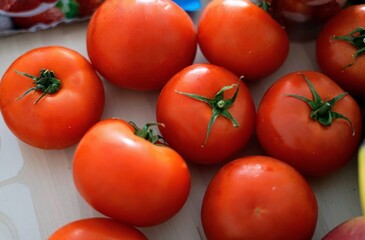 Fresh Ripe Tomatoes Beautifully Arranged on a Rustic Wooden Surface