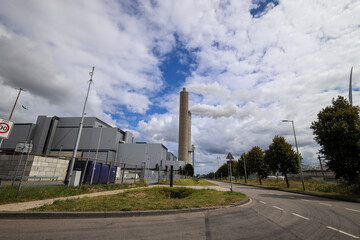 Amsterdam, The Netherlands - August 23rd, 2025 - Steam from the chimneys of waste incinerator AEB in Westpoort harbor