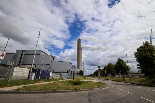 Amsterdam, The Netherlands - August 23rd, 2025 - Steam from the chimneys of waste incinerator AEB in Westpoort harbor