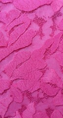 Close-up view of textured pink lace fabric.