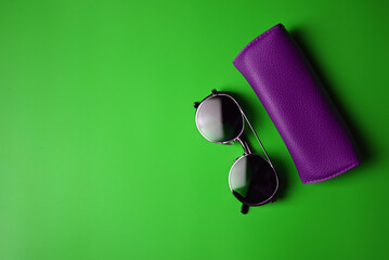 vintage sunglasses on green background