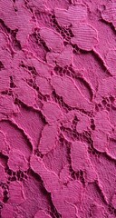 Close-up view of a vibrant magenta lace fabric.