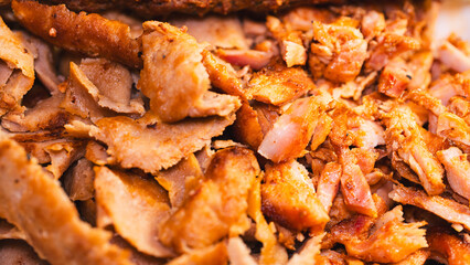 Delicious and healthy mixed grill platter featuring juicy chicken shish, tender lamb shish, and sliced chicken doner kebab. Served on a rustic wooden board. Perfect for food blogs, menus and more.