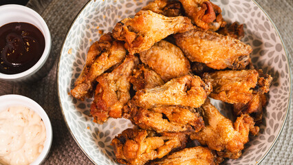 Close-up of golden-brown, crispy fried chicken served on a stylish plate. Highlights the perfect texture and seasoning. Ideal for food blogs, restaurant menus, and social media content promoting comfo