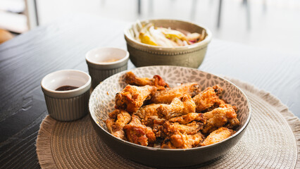 Golden-brown crispy fried chicken served with a fresh side salad bowl and creamy dipping sauce. Perfectly styled for food photography, highlighting texture and balance. Ideal for menus, blogs, and soc