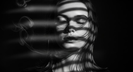 Artistic portrait of young caucasian female with shadows and smoke