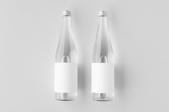 Water bottle mockup with blank label, clear glass
