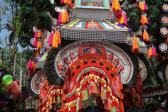 Kavadi is a ceremonial offering carried by Hindu devotees, primarily during the Thaipusam festival Kavadiyattam is dance with Kavadi follows the rhythm of percussions like chenda, and Nadaswaram