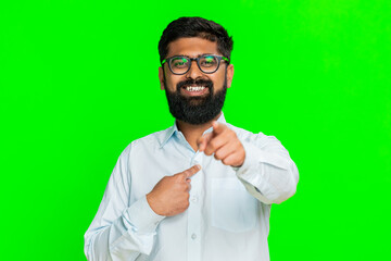 Indian man points directly at camera with confident smile, expressing personal choice, saying its...