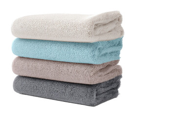 Stack of soft, fluffy bath towels in various colors, isolated on white transparent background