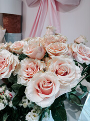 Beautifully arranged soft pink roses with delicate petals in a floral setting