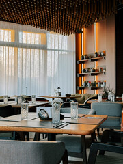 Modern dining area with elegant decor and soft lighting in a restaurant setting