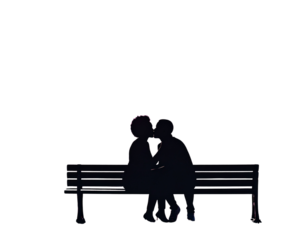 Silhouette of a couple kissing on a park bench for romantic design themes.