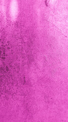 Close-up of a magenta painted wall with visible grunge stains and subtle scratches