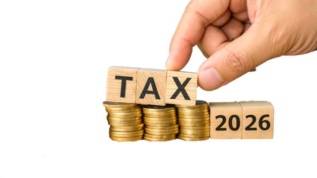 A person's hand holds a wooden box with the word Tax on it, symbolizing a business concept of advertising and success