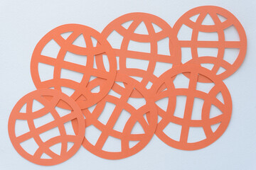 machine-cut orange paper circles with bands arranged overlapping on blank paper