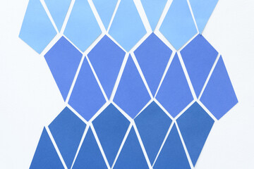 kite-shaped paper pieces arranged in a net form on blank paper