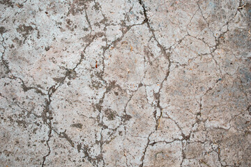 Imagen horizontal de una pared de cemento con grietas
