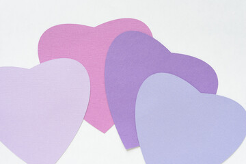 set of four large paper hearts each partly overlapping the other