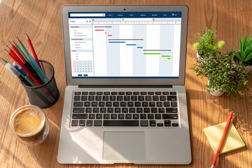 Project planning software for modish business project management on the computer screen showing...
