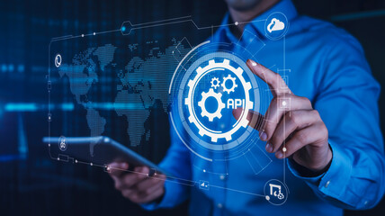 Man interacts with digital interface showing API and global network, symbolizing business integration and connectivity