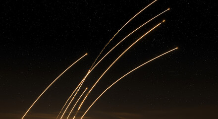Night sky with multiple trails of light captured in motion