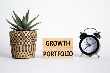 Growth Portfolio symbol. Concept word Growth Portfolio on wooden blocks. Beautiful white background with alarm clock and succulent plant. Business and Growth Portfolio concept. Copy space