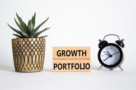 Growth Portfolio symbol. Concept word Growth Portfolio on wooden blocks. Beautiful white background with alarm clock and succulent plant. Business and Growth Portfolio concept. Copy space