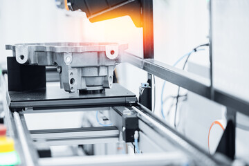 Cnc coordinate measuring machine inspecting metal component in industrial conveyor