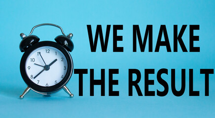 We make the result symbol. Beautiful blue background with alarm clock with words We make the...