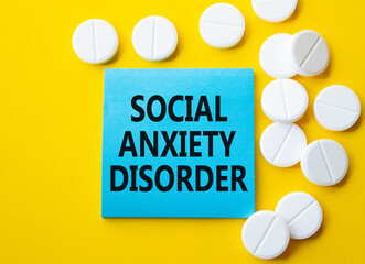Social Anxiety Disorder symbol. Concept words Social Anxiety Disorder on blue note. Beautiful...