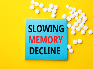 Slowing Memory Decline symbol. Concept words Slowing Memory Decline on blue note. Beautiful yellow...