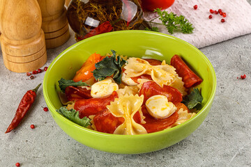 Italian pasta farfalle with pepperoni