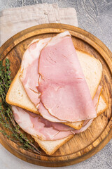 Ham sandwich, Bread with sliced pork meat. grey background. top view