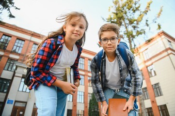 Portrait of smiling school kids standing at school yard
