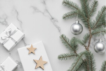Elegant Christmas Setup with Gifts, Pine Branches, and Ornaments on Marble Surface