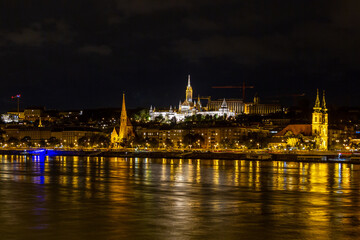 Night view of Danube River with illuminated Buda landmarks including Matthias Church, Fisherman's...