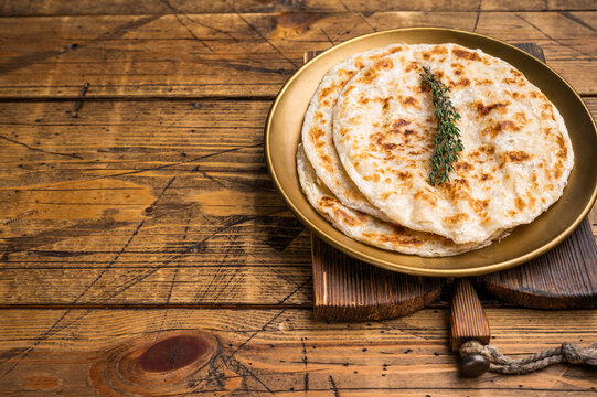 Potato Stuffed Flat Bread Aloo paratha, Traditional Indian food. wooden background. top view
